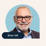 Photo of Brian Gill with a blue background