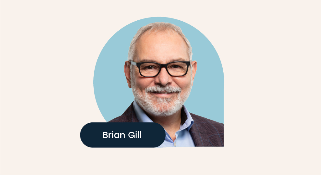 Photo of Brian Gill with a blue background