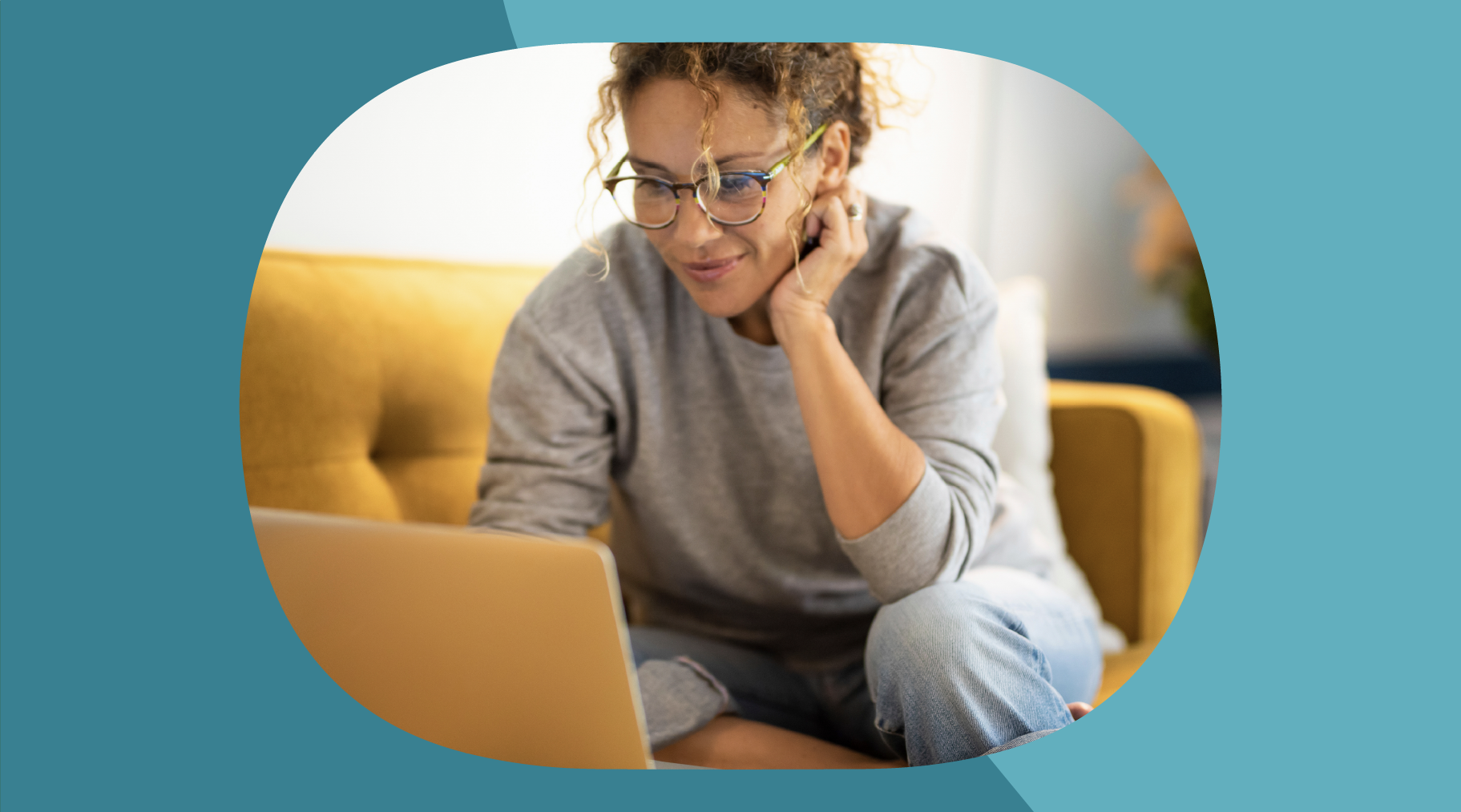 Woman at home reading on her laptop