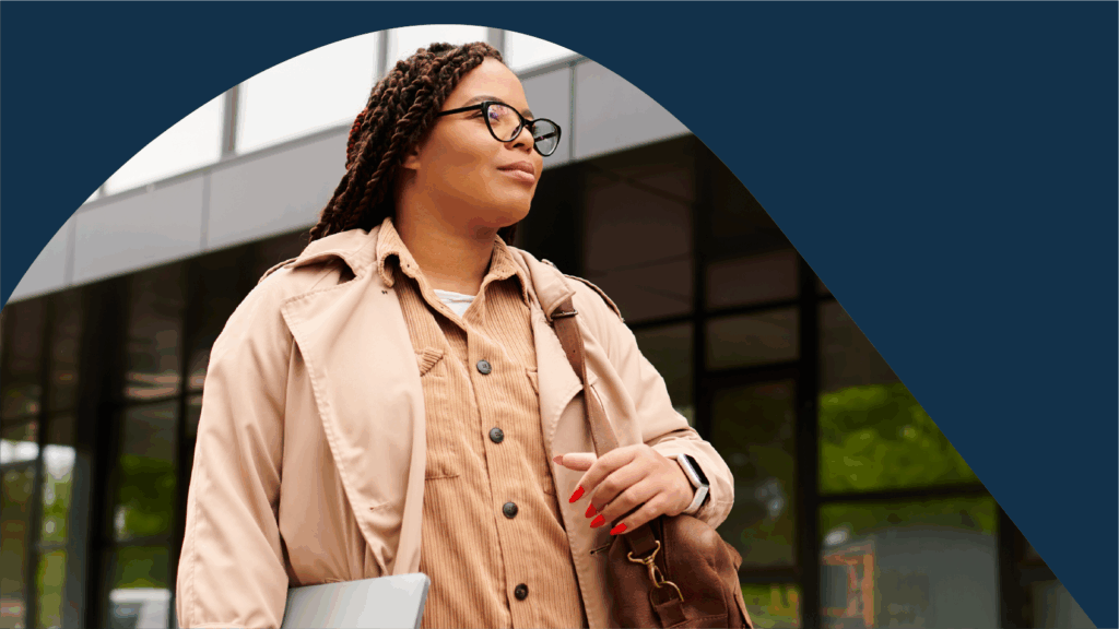 Woman with laptop and bag on campus